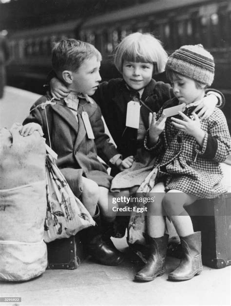 Labelled evacuees waiting for their train out of Euston Station in ...