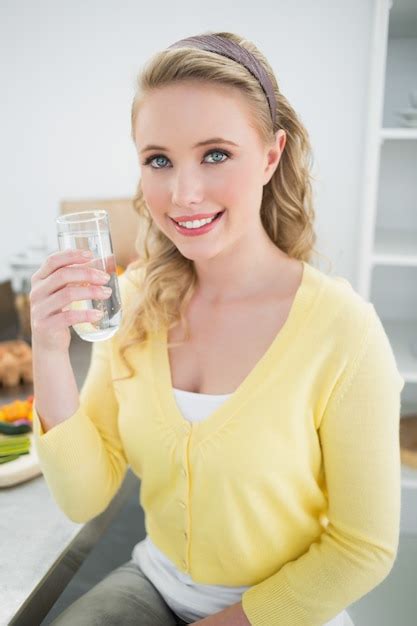 Premium Photo Happy Cute Blonde Holding A Glass Of Water