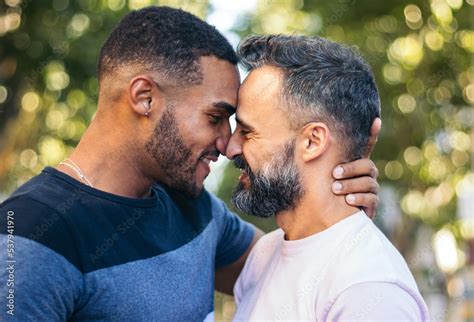 Multiracial Gay Couple Kissing Outdoors Stock Photo Adobe Stock