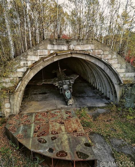 Rusting Mig-23 Soviet combat aircraft in its shelter, near Komsomolsk ...