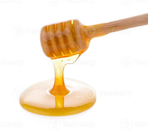 Wooden honey dipper with honey 4289087 Stock Photo at Vecteezy