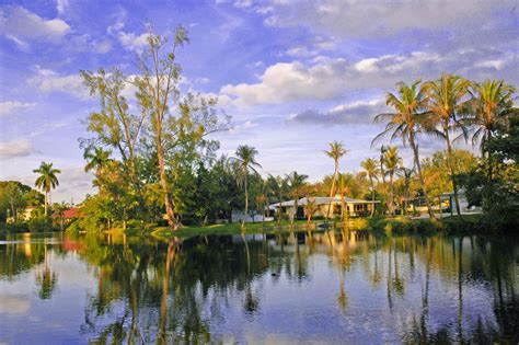 The Lakeside Charm Of This Residential Neighborhood Is An Example Of Tropical Living At Its Best