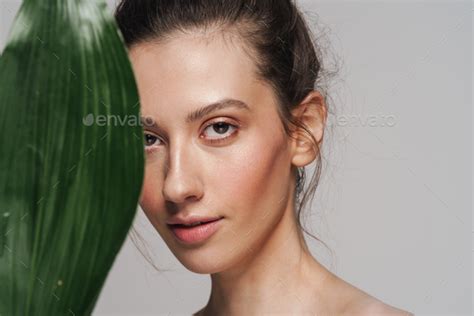 Beautiful Half Naked Woman Posing With Green Leaf On Camera Stock Photo