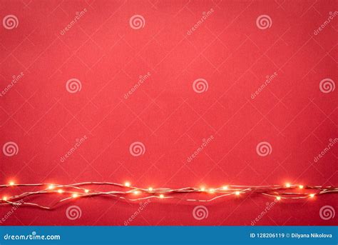 Christmas Lights Garland Border Over Red Background Flat Lay Copy