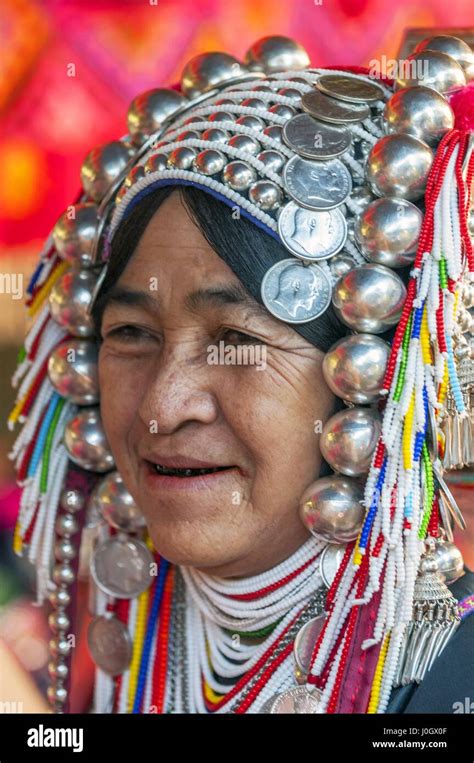 Akha Tribeswoman In Traditional Clothing And Wearing An Ornate