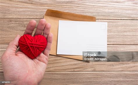 Empty Postcard In Hand With Heart Stock Photo Download Image Now