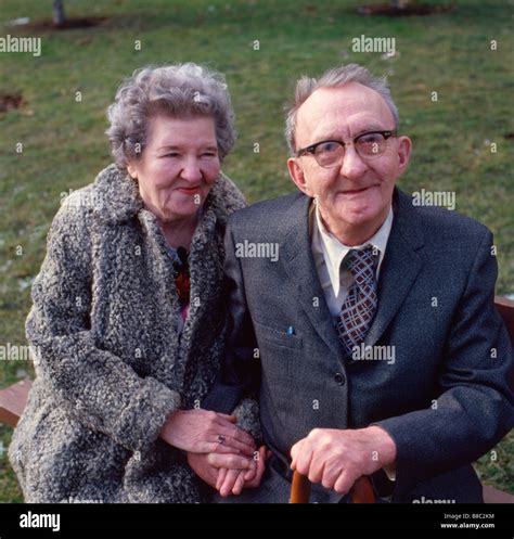 Senior Couple Sitting Park Bench Stock Photo Alamy