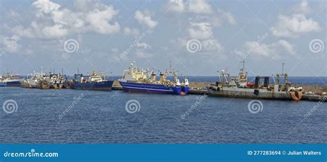 Deep Water Trawlers Discharging Their Catch Along The Outer Breakwater