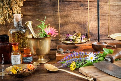 Ancient Natural Medicine Herbal Vials And Scale On Wooden Background