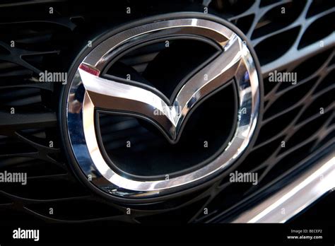 Mazda emblem on a car Stock Photo - Alamy