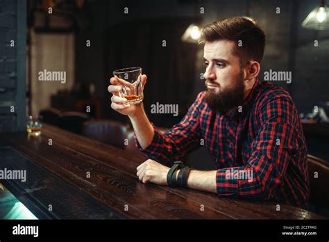 One Man Sitting At The Bar Counter And Drink Alcohol Beverage Male