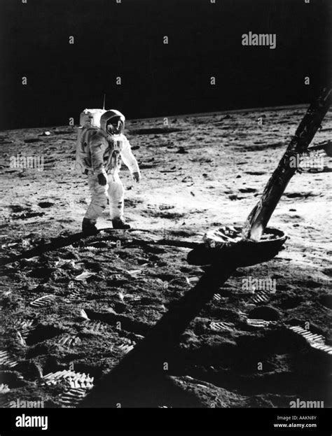 1960s Astronaut Buzz Aldrin In Space Suit Walking On The Moon Near The