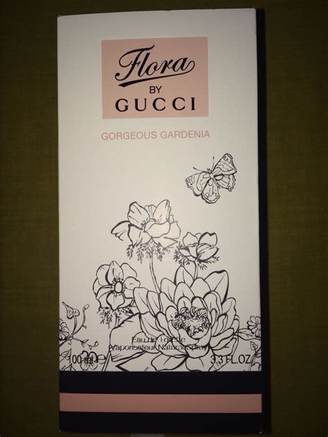 the back of a gucci box with flowers and butterflies on it