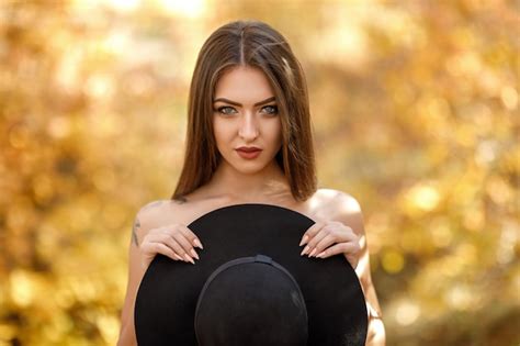 Premium Photo Portrait Of Naked Woman With Hat At Park