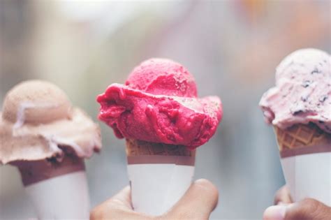 Premium Photo Woman S Hands Holding Melting Ice Cream Waffle Cone In