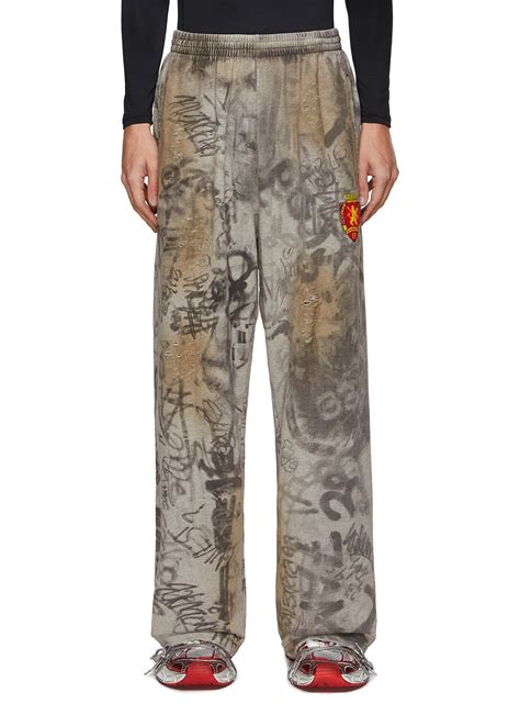 Balenciaga All Over Graffiti Print Ripped Baggy Sweatpants In Gray For