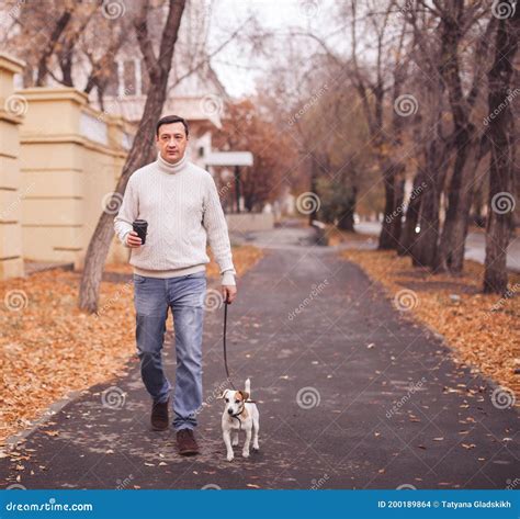 Man Walks With His Dog Stock Photo Image Of Background 200189864