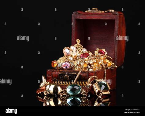 Wooden Chest Full Of Gold Jewelry On Black Background Stock Photo Alamy