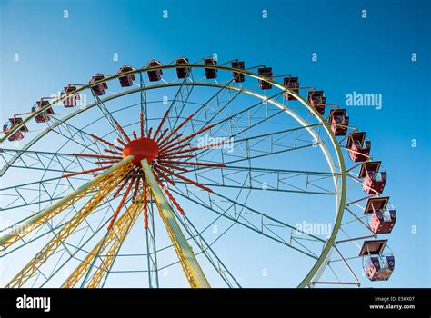 Attraction Ferris Wheel Against The Clear Blue Sky Stock Photo Alamy