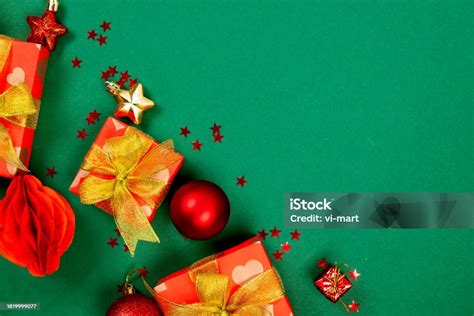 Stylish Red And Golden Christmas Baubles Red T Boxes At Green