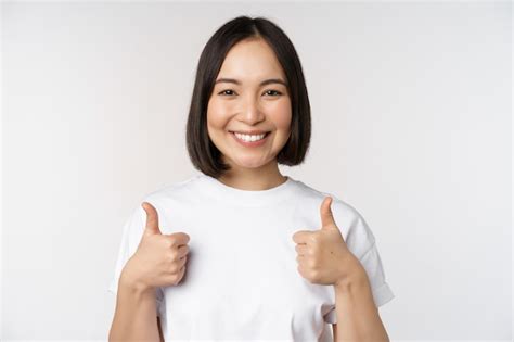 Free Photo Happy Young Korean Woman Showing Thumbs Up And Smiling