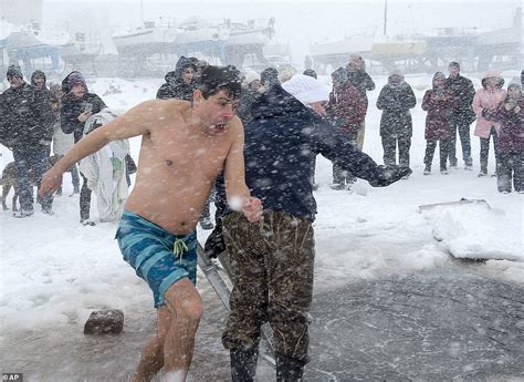 People All Over The World Participate In Polar Bear Plunges Across The