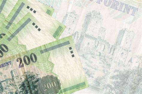 200 Hungarian Forint Bills Lies In Stack On Background Of Big Semi