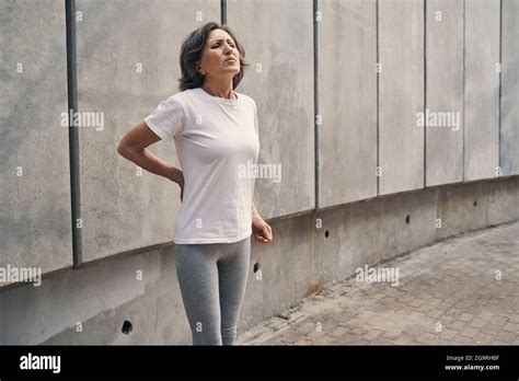 Slim Mature Woman Suffering From Pain While Running Stock Photo Alamy