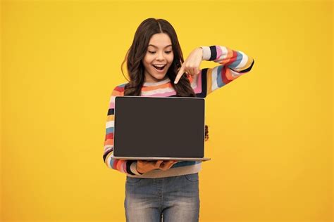 Premium Photo Amazed Teenager Teenager School Girl Hold Notebook Laptop Screen Of Laptop Computer