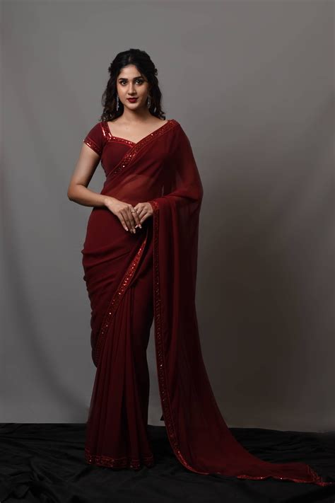 Actress Rabiya Khatoon in a ruby red georgette designer saree