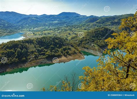 Beautiful Bright Landscape Of Green Hills And A Lake Stock Photo