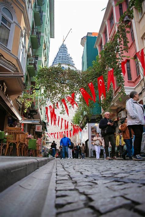 View Of The Galata Tower In Istanbul A Street With Turkish Flags