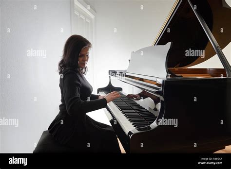 Woman Playing Piano Alone Hi Res Stock Photography And Images Alamy