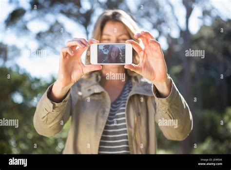 Smiling Woman Taking Selfies Stock Photo Alamy