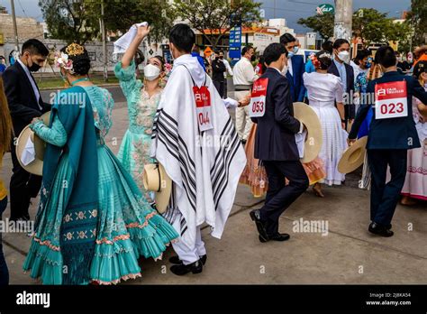 Young Peruvian Dancers In Costume Wait To Take Part In A Marinera Dance