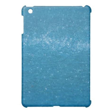 a blue ipad case with some water in the backgroung and snow on it