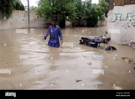 Karachi Aug A Man Wades Through Floodwater