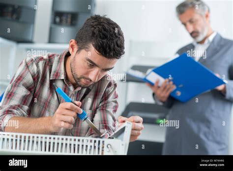 Man Fixing And Mounting Air Conditioning Stock Photo Alamy