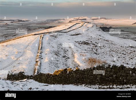 Hadrian S Wall Under A Light Covering Of Snow Looking West Over Caw