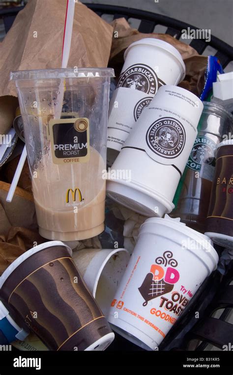 An Overflowing Trash Can In New York Filled With Coffee Cups From