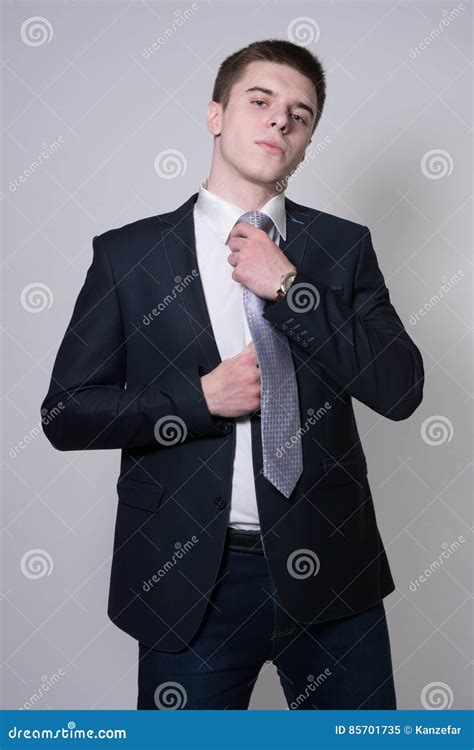 Portrait Of A Business Man Adjusting His Tie Stock Image Image Of