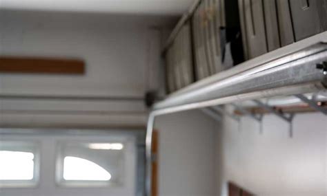 how to clean garage door tracks