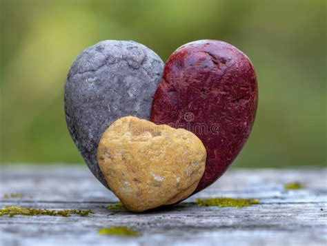 Colorful Heart Shaped Stones On Wooden Surface Stock Illustration