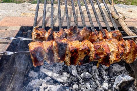 Grilled Pieces Of Pork Meat On Metal Skewers Shashlik Or Shish Kebab