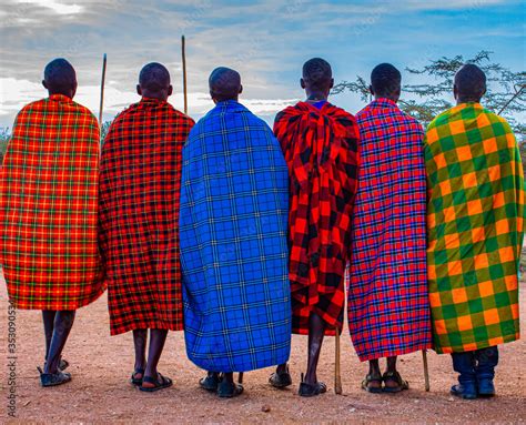 Group Of Maasai Tribesmen From East Africa With Spears And Colourful