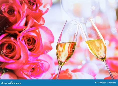 Champagne Flutes With Golden Bubbles On Wedding Roses Flowers Background Stock Image Image Of