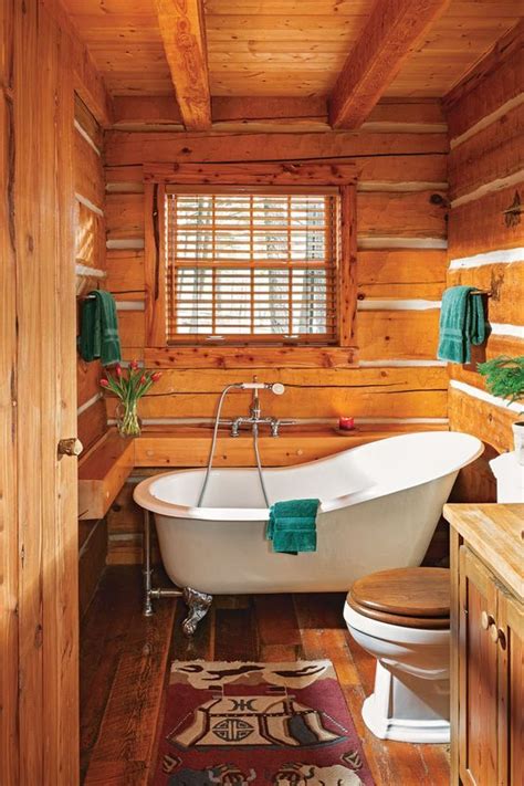 A Cozy Log Cabin Bathroom Fully Clad With Wood With Wooden Frames And