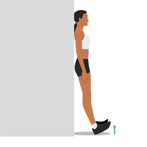 Woman doing foot flex shin exercise leaning against wall. 26751895