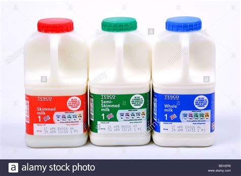 Fresh Milk Skimmed Semi Skimmed And Whole Milk In Tesco Bottles Stock