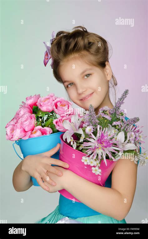 Happy girl with beautiful flowers Stock Photo - Alamy